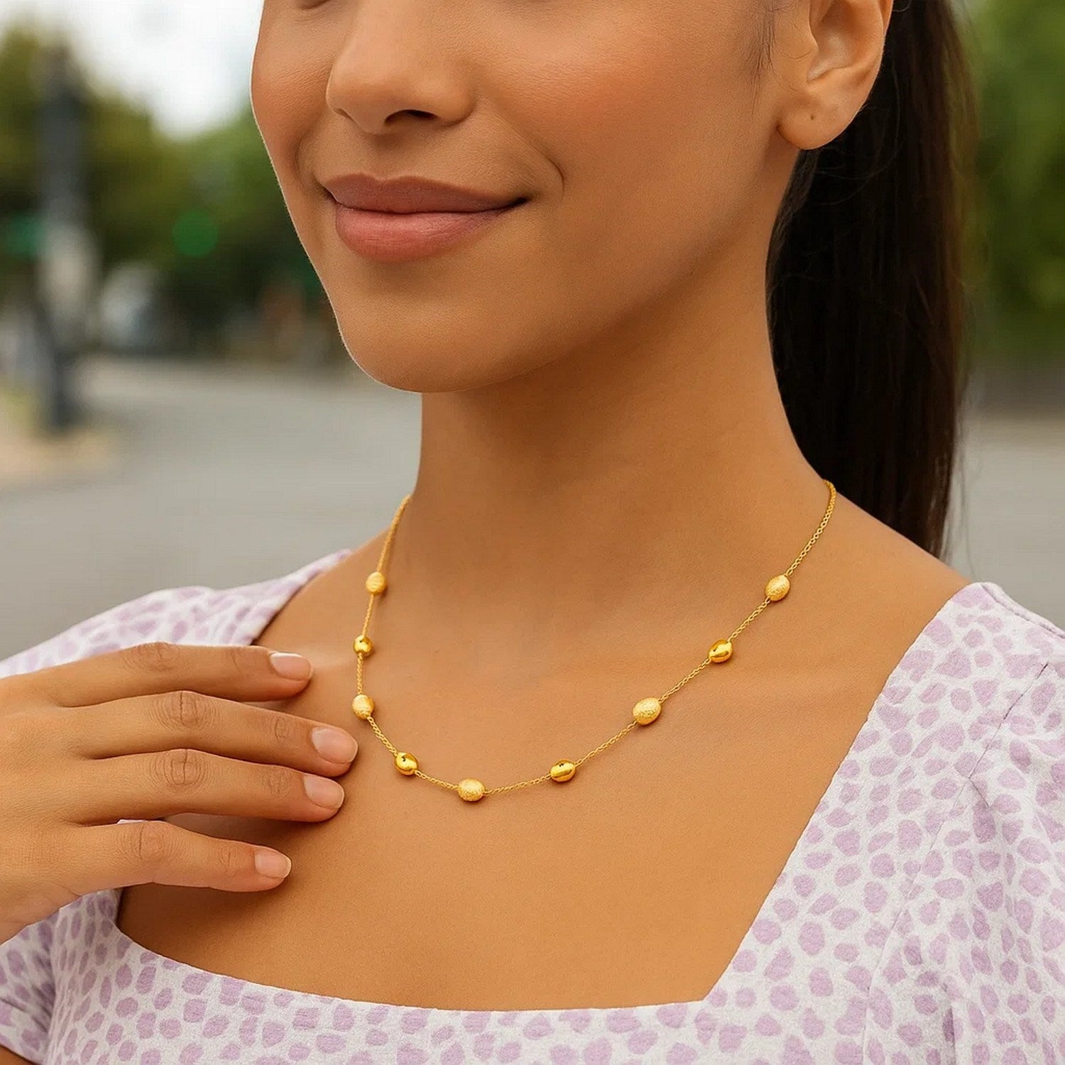 14k Yellow Gold Necklace with Polished and Textured Pebble Stations