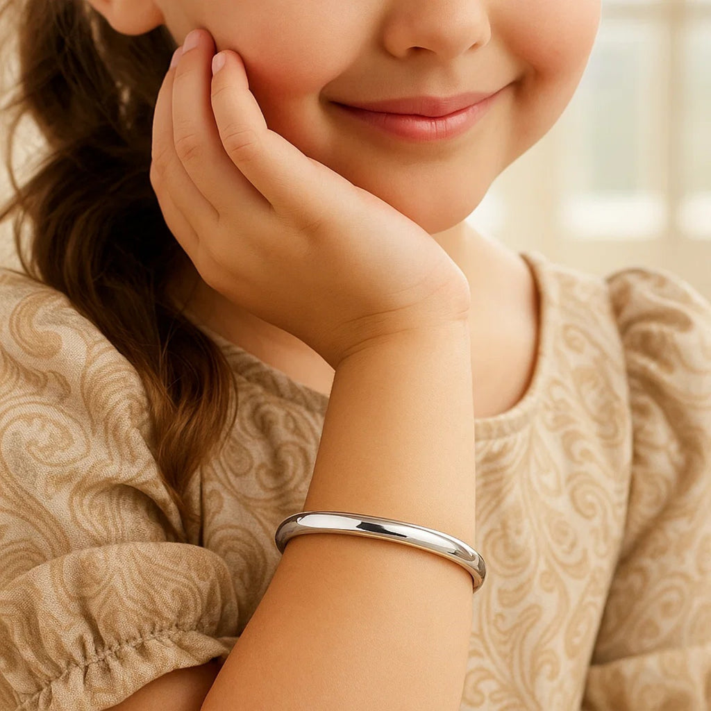 14k White Gold Dome Childrens Bangle with a Polished Finish (5.50 mm)