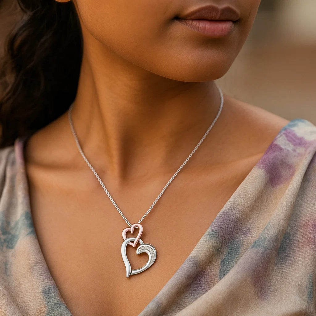 Sterling Silver Cascading Dual Heart Diamond Accented Pendant (.02 cttw)