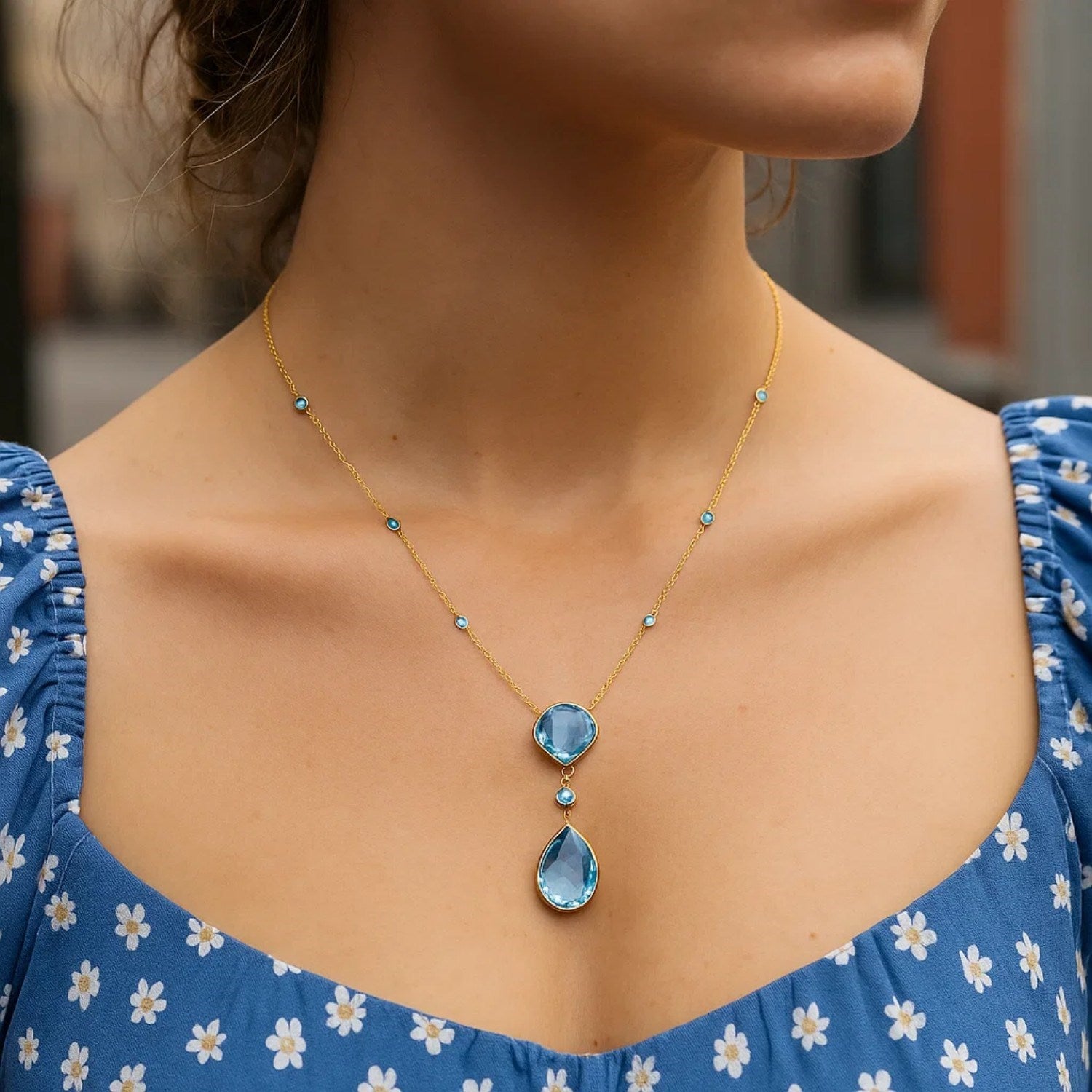 14k Yellow Gold Necklace with Pear-Shaped and Cushion Blue Topaz Briolettes