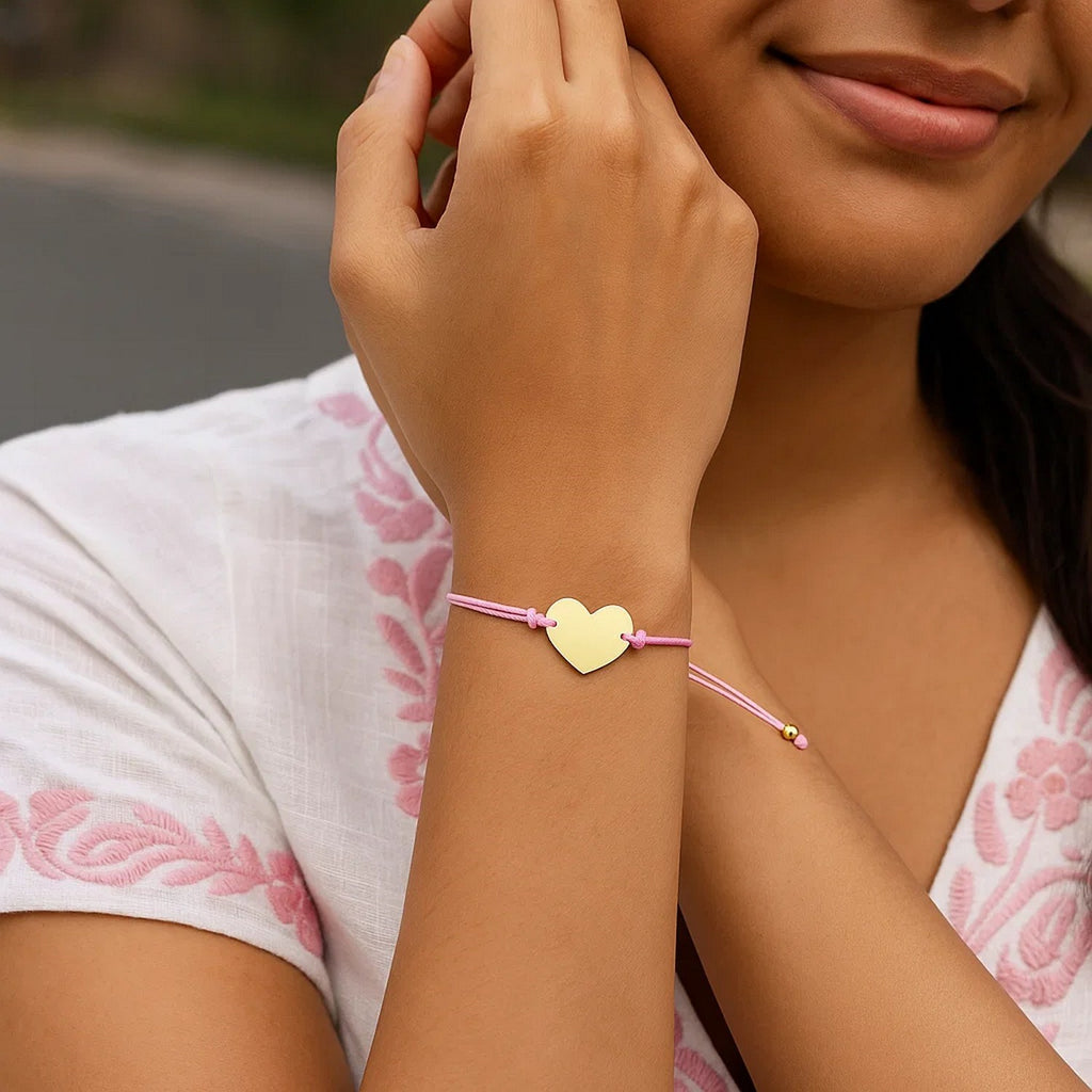9 1/4 inch Pink Cord Adjustable Bracelet with 14k yellow Gold Heart