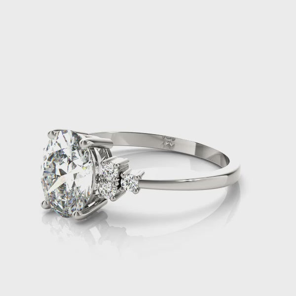 Oval Solitaire Cluster Side Engagement Ring
