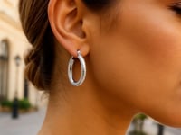 14k White Gold Diamond Cut Textured Oval Hoop Earrings.